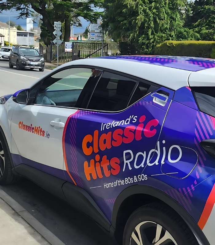 classic hits promo car on road